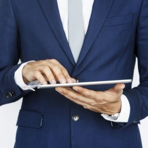 Cropped Business Guy Using Tablet Concept